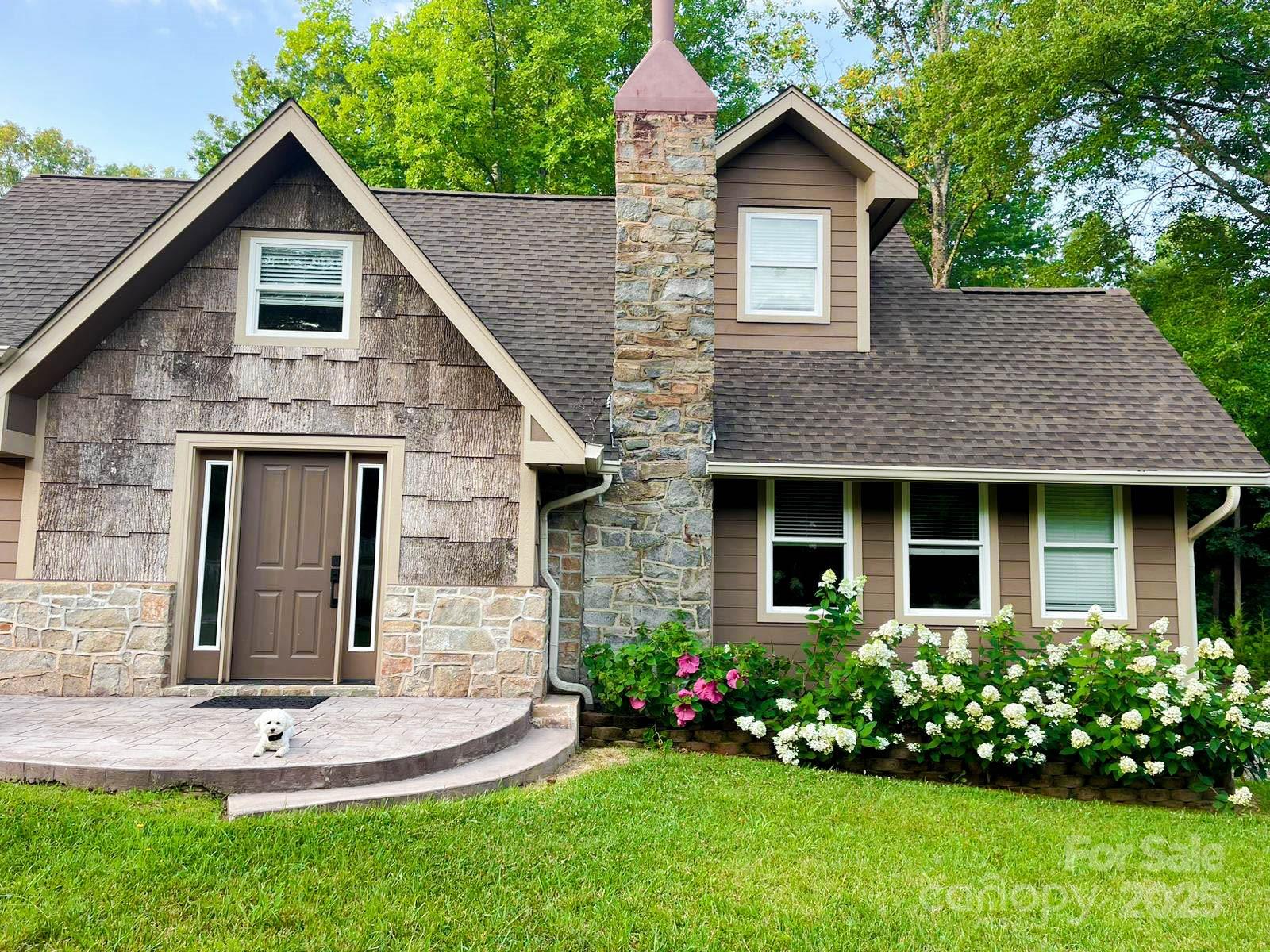 141 Carnegie Road Rutherfordton, NC 28139 - Photo 4 of 48 a front view of a house with a garden and plants