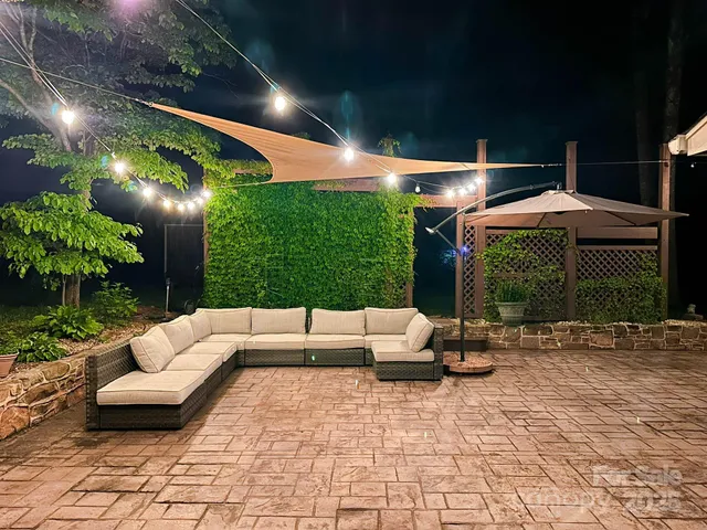 a lobby with furniture and potted plants