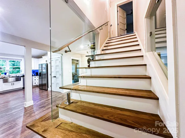 a view of entryway with wooden floor and a potted plant