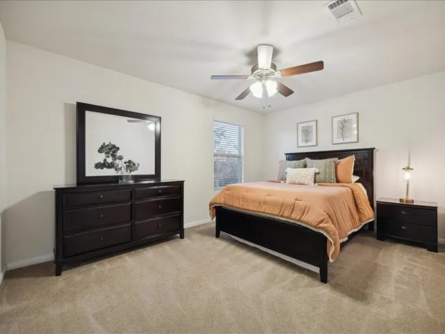 a bedroom with a bed and window