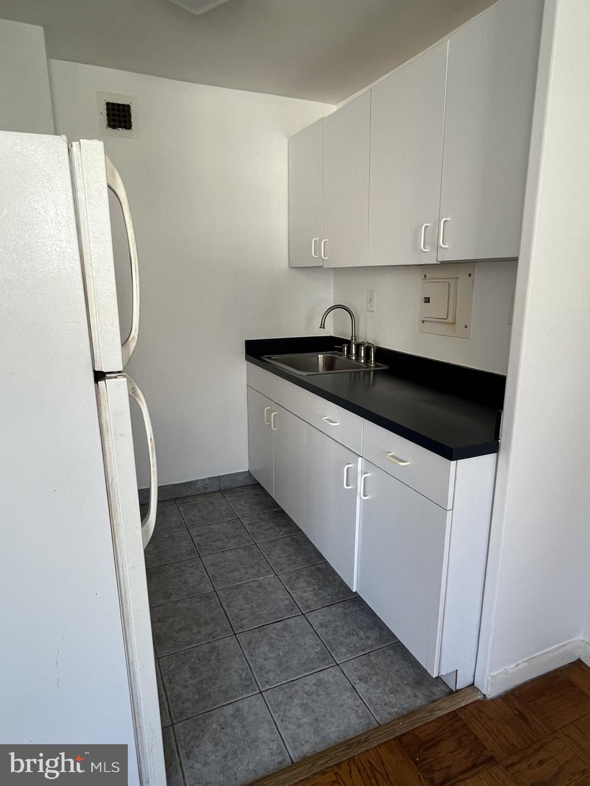 522 21st Street Northwest, Unit 811 Washington, DC 20006 - Photo 16 of 23 a kitchen with a sink and cabinets