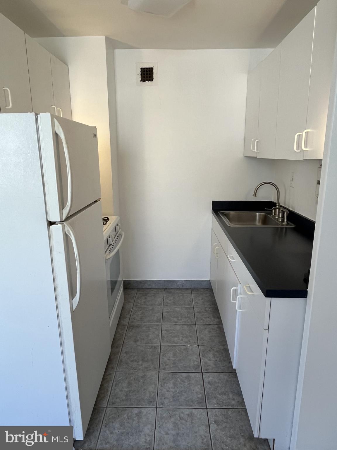 522 21st Street Northwest, Unit 811 Washington, DC 20006 - Photo 18 of 23 a utility room with dryer and washer