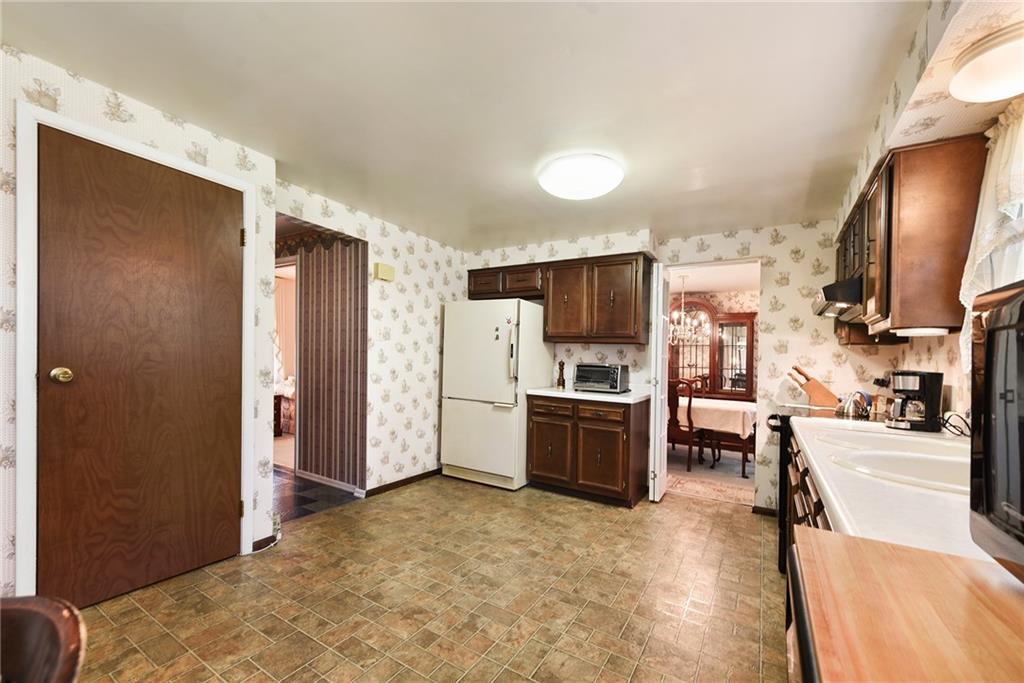 159 Pinehurst Drive Freedom, PA 15042 - Photo 11 of 33 a view of a kitchen with furniture and refrigerator