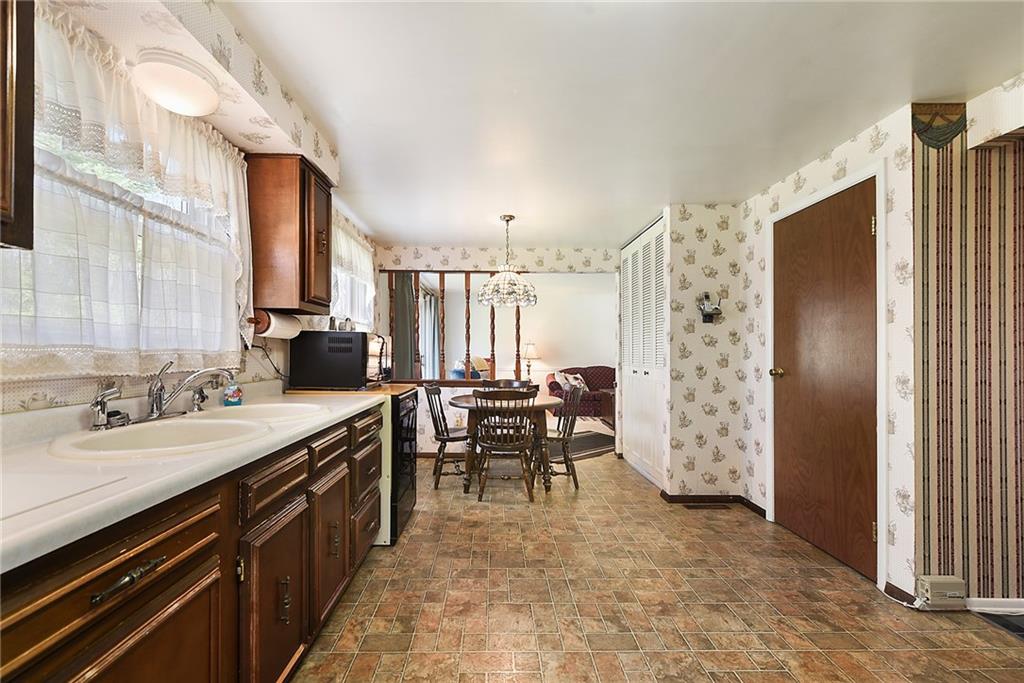 159 Pinehurst Drive Freedom, PA 15042 - Photo 12 of 33 a view of a kitchen with dining room and windows