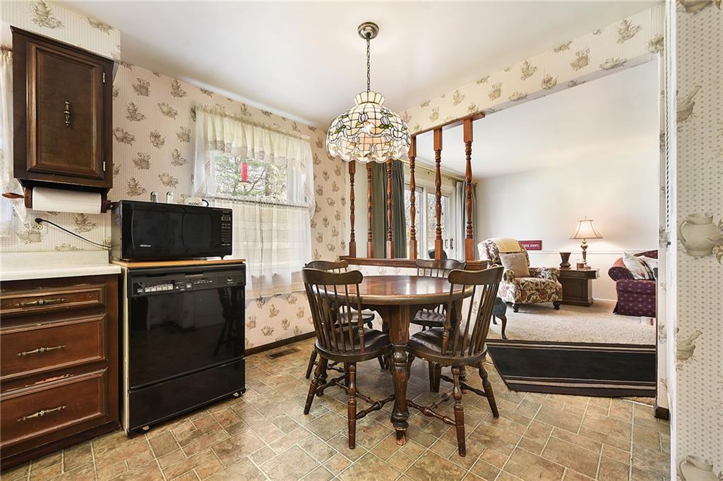 159 Pinehurst Drive Freedom, PA 15042 - Photo 13 of 33 a view of a dining room with furniture window and wooden floor