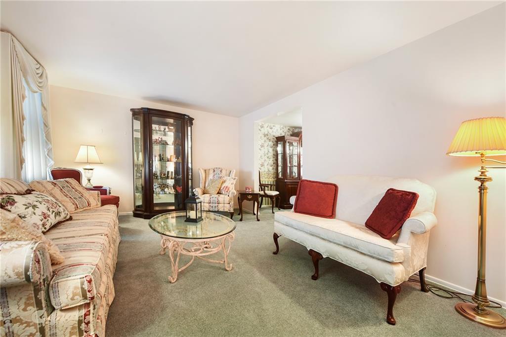 159 Pinehurst Drive Freedom, PA 15042 - Photo 15 of 33 a living room with furniture a rug and a lamp