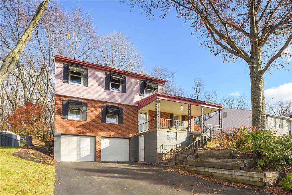 159 Pinehurst Drive Freedom, PA 15042 - Photo 2 of 33 a front view of a house with a yard