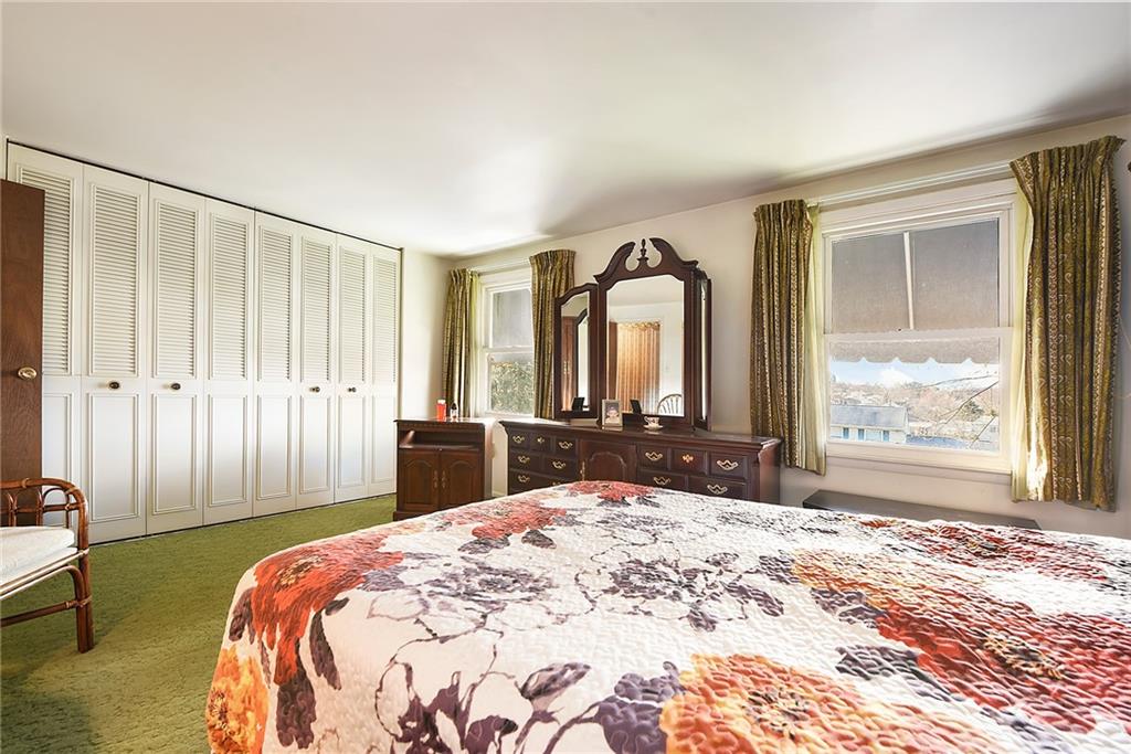 159 Pinehurst Drive Freedom, PA 15042 - Photo 22 of 33 a bedroom with a large bed and a window