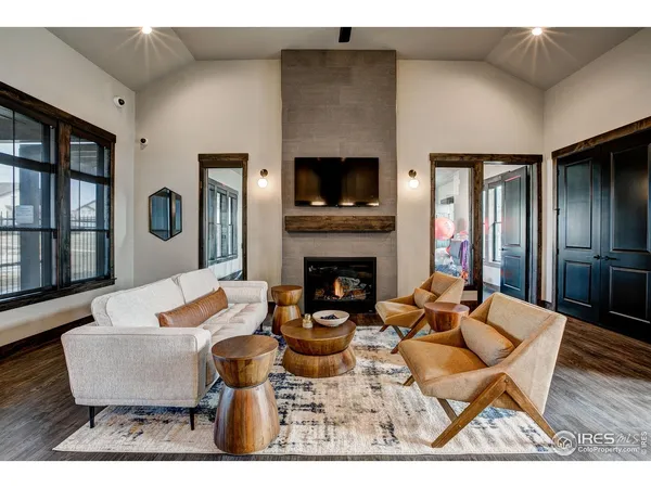 a living room with fireplace furniture and a fireplace