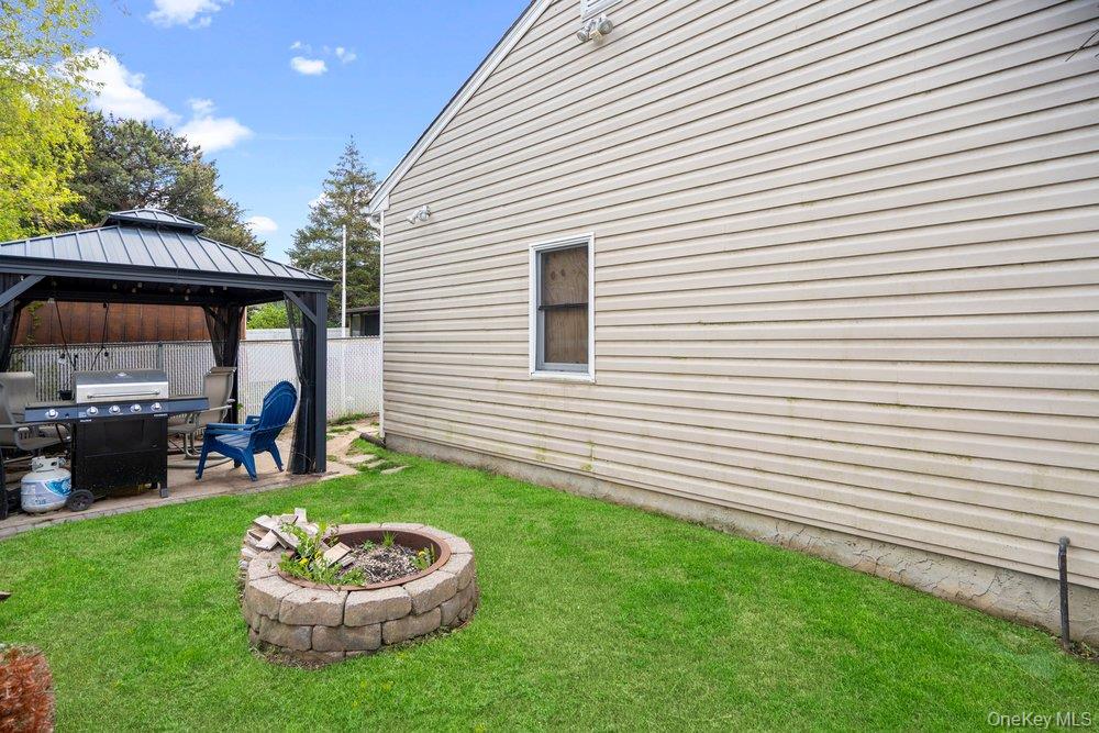 101 Sexton Road West Babylon, NY 11704 - Photo 27 of 33 a view of a backyard with plants and a patio