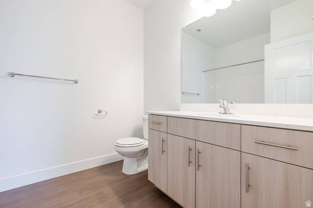 693 West 4500th South, Unit O202 Mapleton, UT 84664 - Photo 6 of 16 Full bathroom featuring vanity, dark wood-style flooring, and a shower