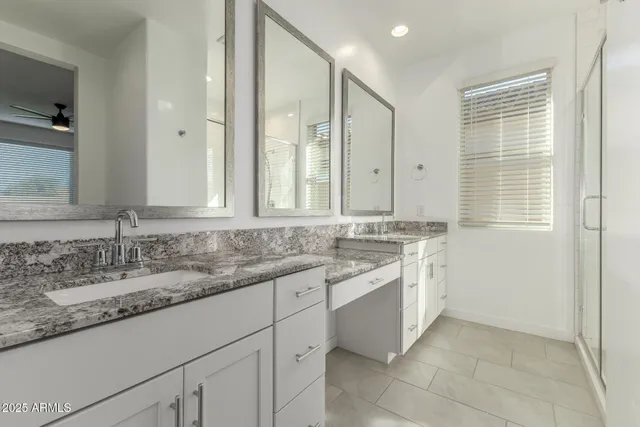 a bathroom with a window and a shower