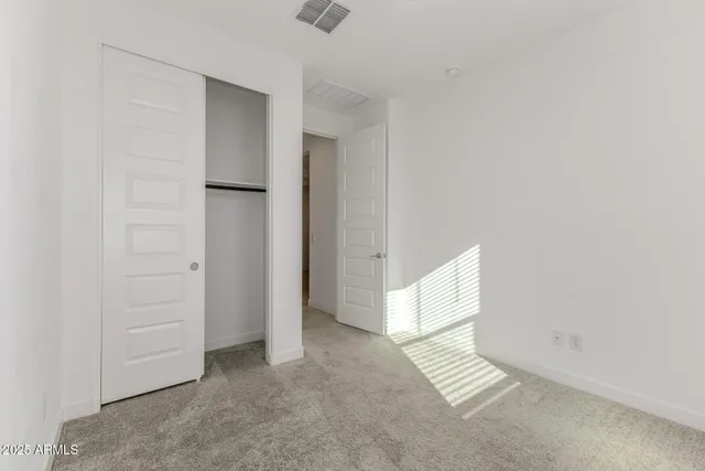 a bathroom with a sink toilet vanity and shower