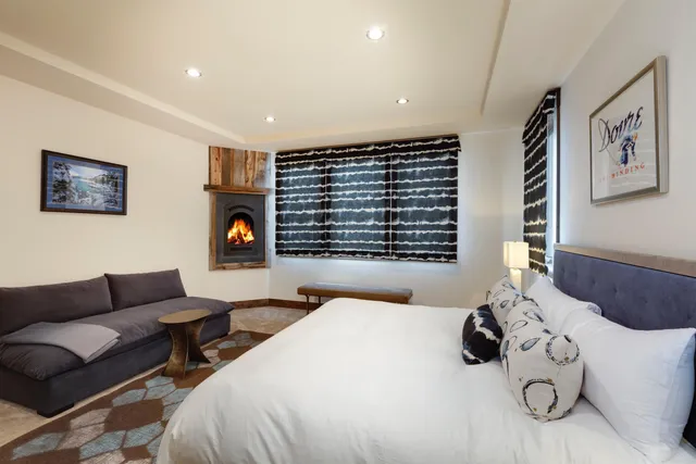 a bedroom with furniture and a window