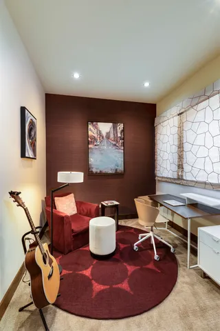 a bedroom with furniture and a bathtub