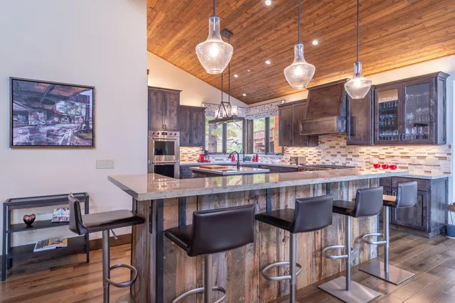 a kitchen with a table and chairs in it