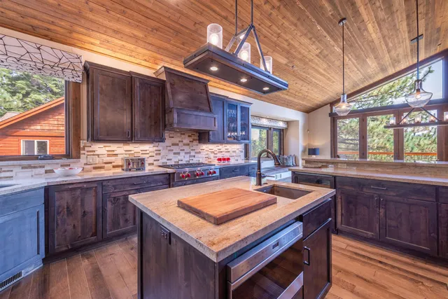 a kitchen with wooden cabinets and sink