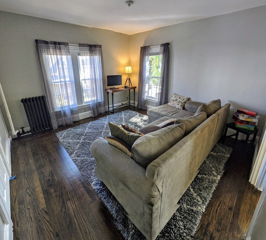74 Sydney Street, Unit 2 Boston, MA 02125 - Photo 1 of 28 a living room with furniture and a window