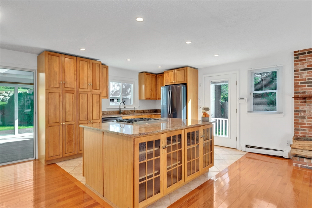 50 Laurel Street Gloucester, MA 01930 - Photo 12 of 40 a kitchen with stainless steel appliances granite countertop a stove and a refrigerator