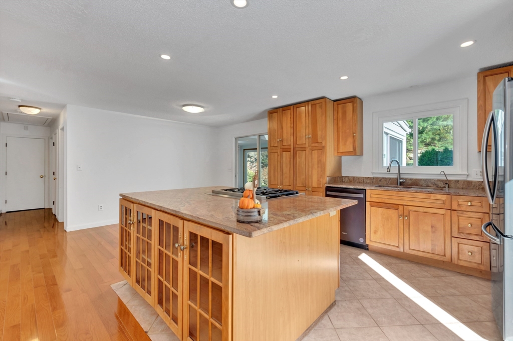 50 Laurel Street Gloucester, MA 01930 - Photo 15 of 40 a kitchen with stainless steel appliances granite countertop a stove a sink and a refrigerator