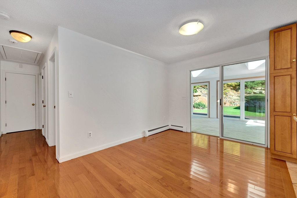 50 Laurel Street Gloucester, MA 01930 - Photo 22 of 40 an empty room with wooden floor and windows