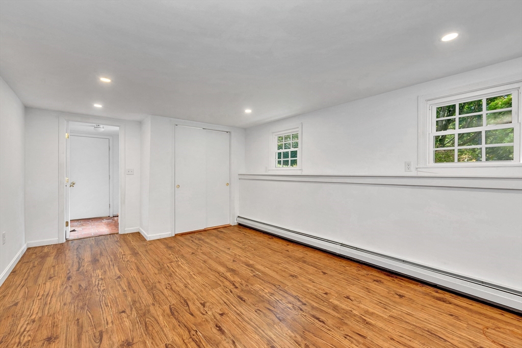 50 Laurel Street Gloucester, MA 01930 - Photo 31 of 40 a view of empty room with wooden floor and fan