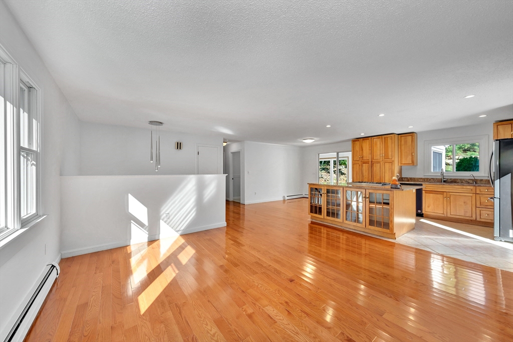 50 Laurel Street Gloucester, MA 01930 - Photo 9 of 40 a living room with furniture and a table with wooden floor