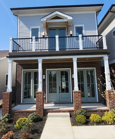 front view of a house with a small yard
