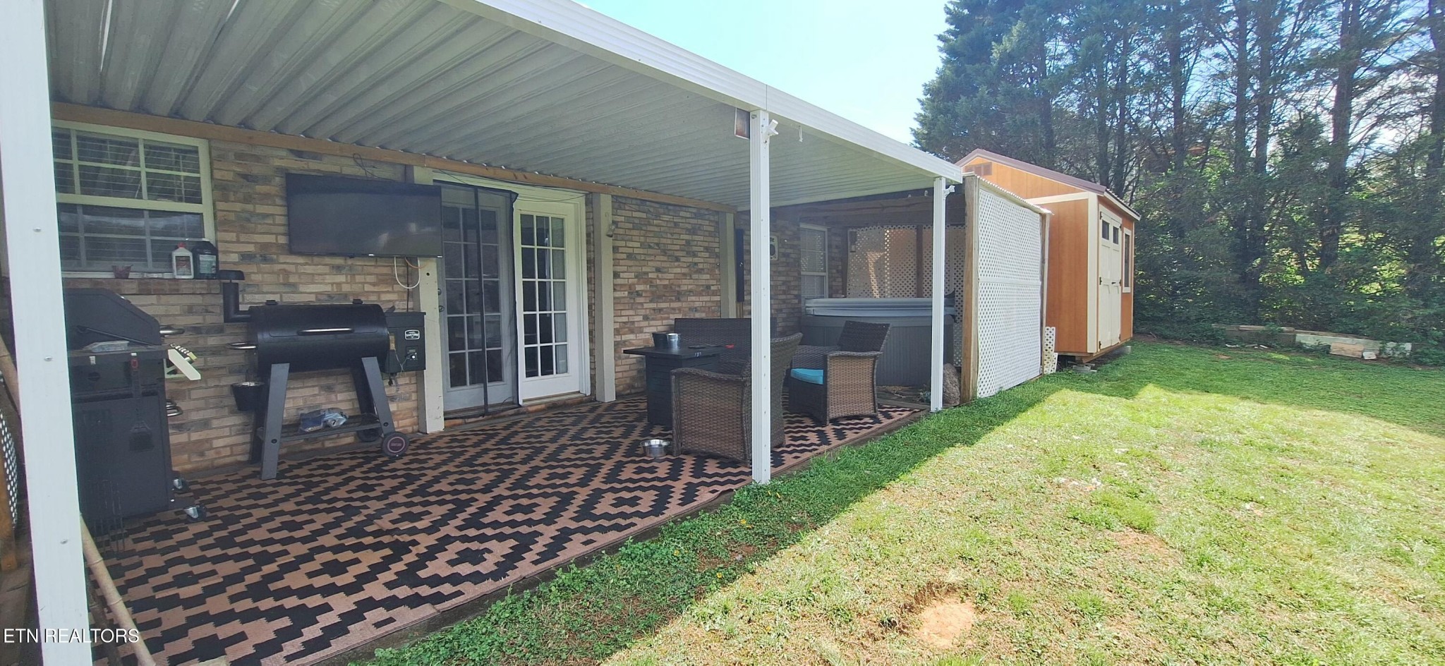 6199 Sinking Creek Road Greenback, TN 37742 - Photo 13 of 33 a view of a house with backyard and porch