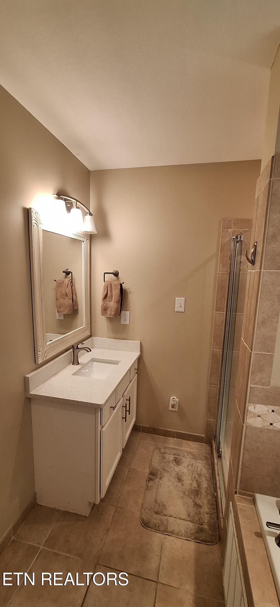 6199 Sinking Creek Road Greenback, TN 37742 - Photo 30 of 33 a bathroom with a sink a toilet and mirror