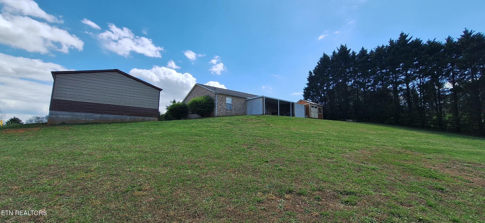 6199 Sinking Creek Road Greenback, TN 37742 - Photo 7 of 33 a view of a house with a yard