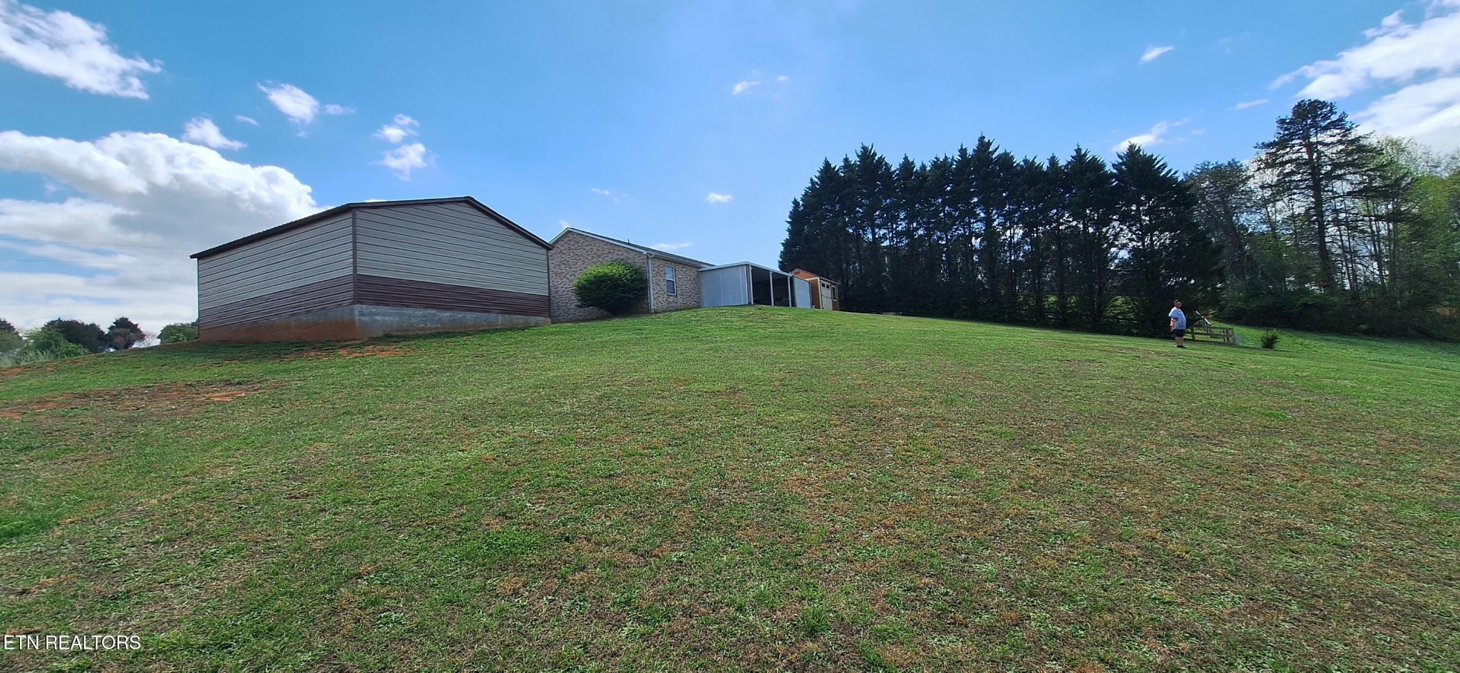 6199 Sinking Creek Road Greenback, TN 37742 - Photo 8 of 33 a view of a back yard of the house