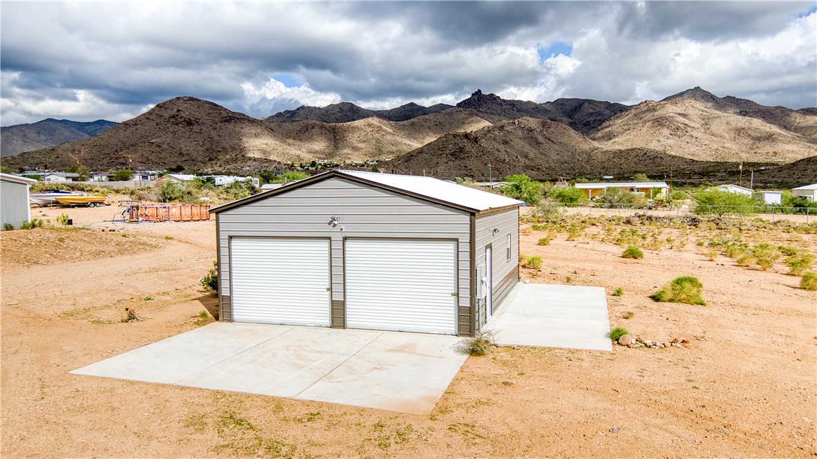 3870 Bouse Road Golden Valley, AZ 86413 - Photo 1 of 29 Detached garage featuring a mountain view