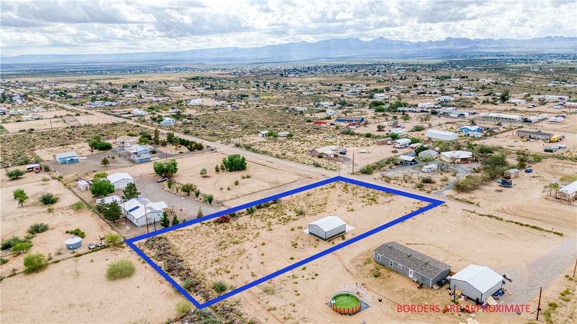 3870 Bouse Road Golden Valley, AZ 86413 - Photo 20 of 29 Aerial view of sparsely populated area featuring a desert landscape and property parcel outlined
