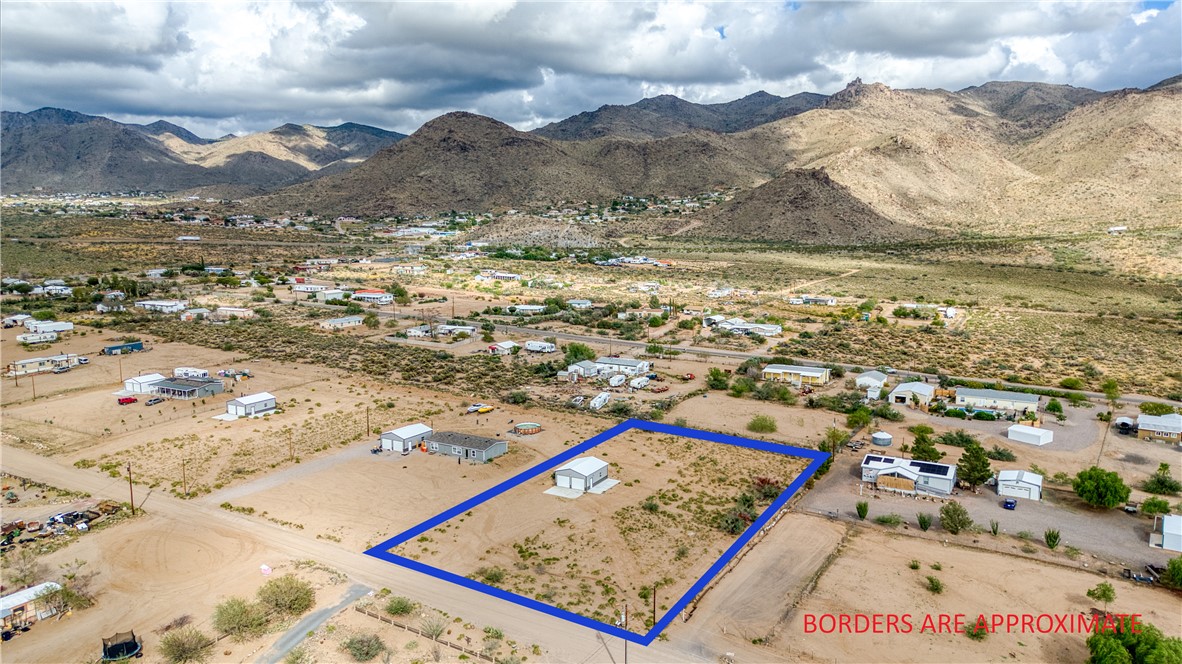 3870 Bouse Road Golden Valley, AZ 86413 - Photo 24 of 29 Overview of rural landscape with a mountain backdrop and property parcel outlined