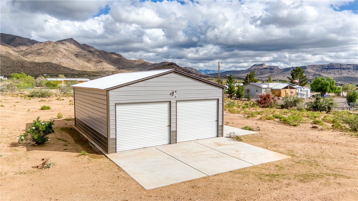 3870 Bouse Road Golden Valley, AZ 86413 - Photo 3 of 29 Detached garage with a mountain view