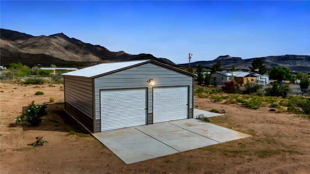 3870 Bouse Road Golden Valley, AZ 86413 - Photo 5 of 29 Detached garage with a mountain view