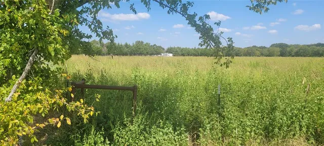 a view of a lake with houses in the back