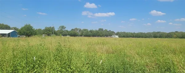 a view of lake with green space
