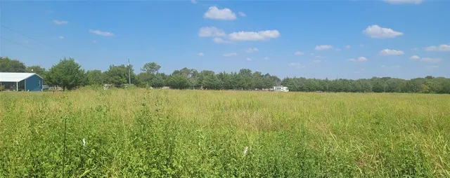 a view of lake with green space