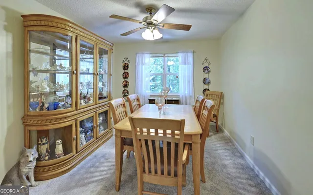 a view of a dining room with furniture window and outside view