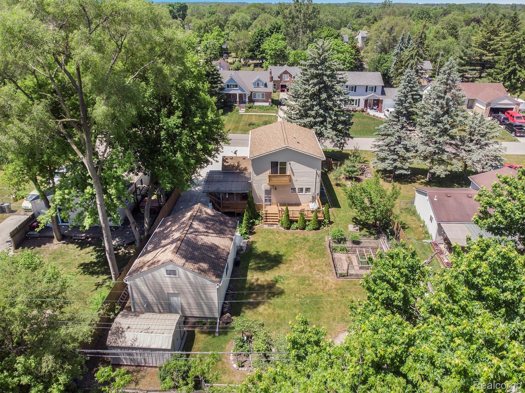 2865 Longview Avenue Rochester, MI 48307 - Photo 28 of 33 Exquisitely kept grounds with multiple gardens and wood burning fire pit.