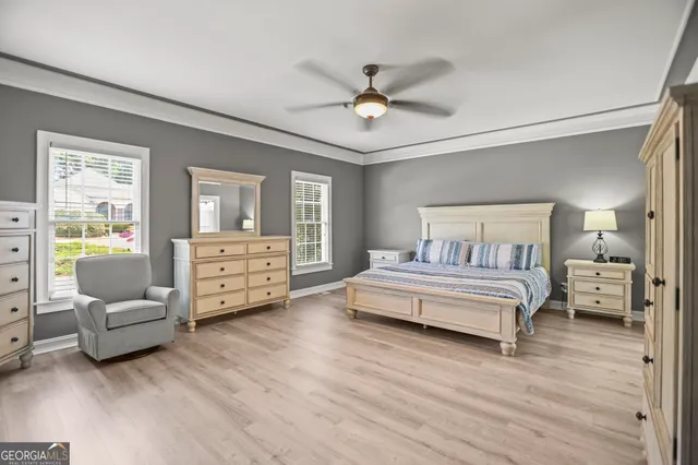 a patio with a table and chairs under an umbrella