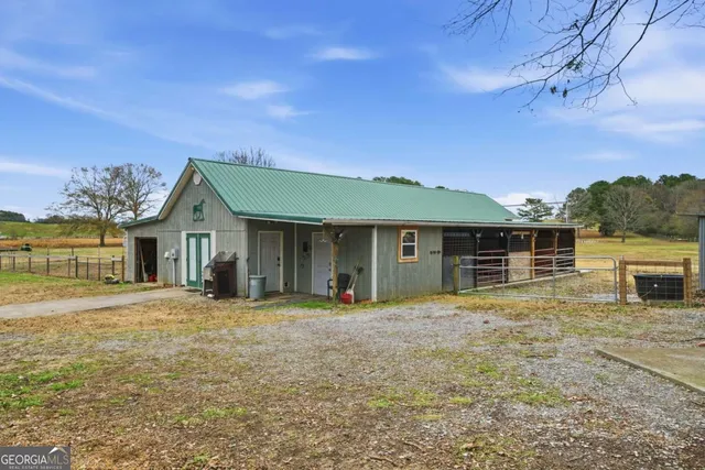 a view of a chairs in back of the house