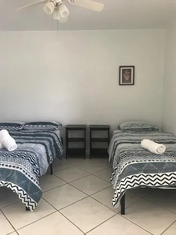 a bedroom with a bed and a table