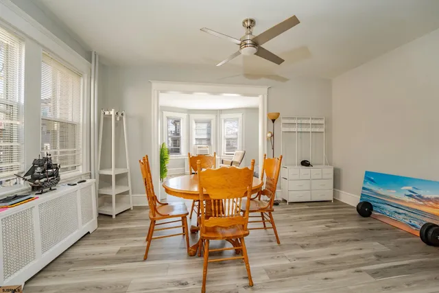 a dining room with furniture and window