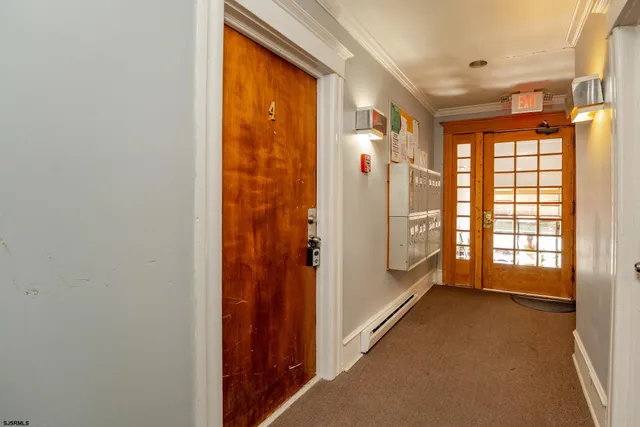 a view of hallway with windows