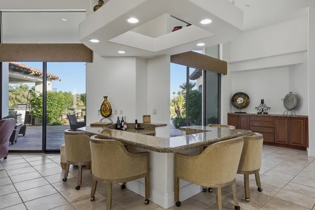 a dining room with furniture and window