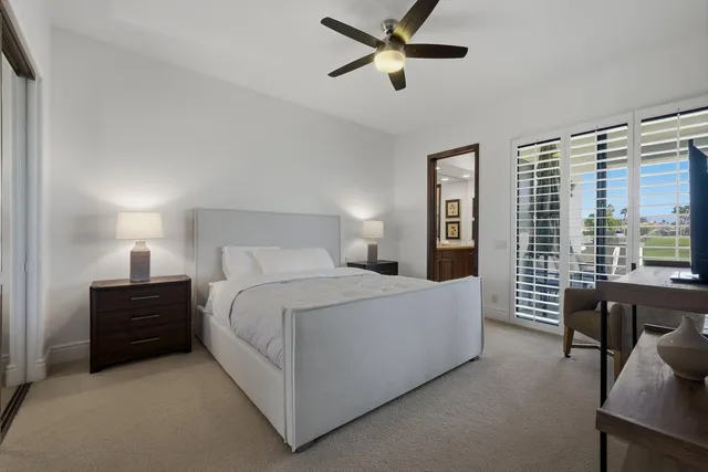 a bed room with a bed and a tv