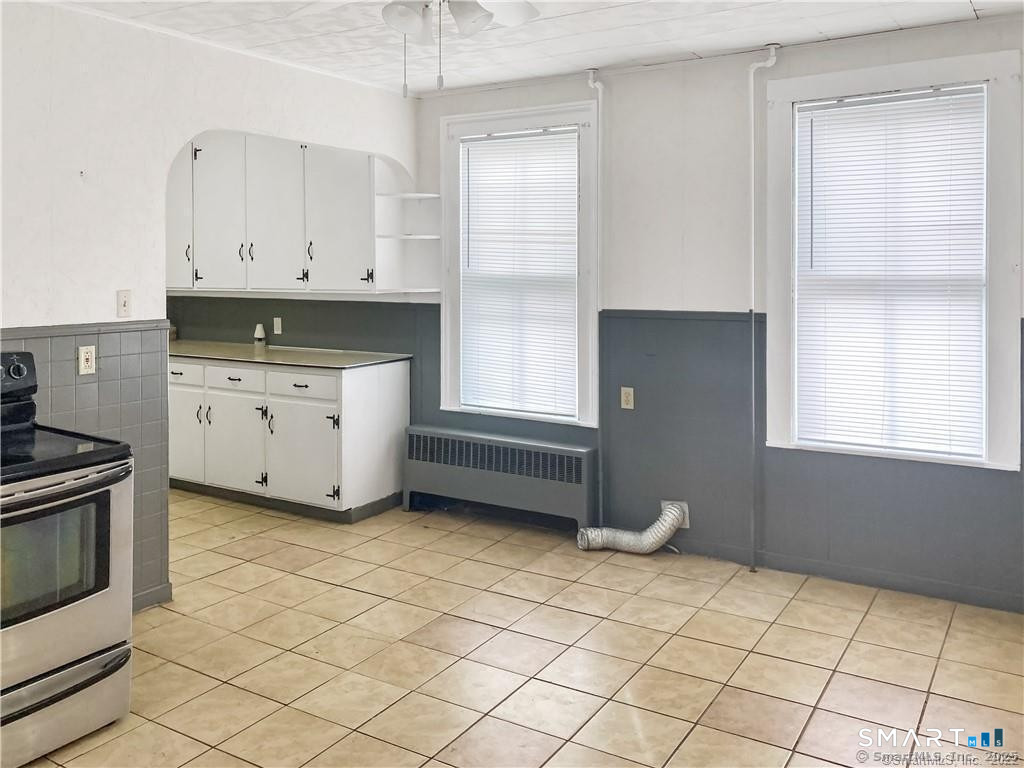 10 Wall Street Middletown, CT 06457 - Photo 5 of 10 a kitchen with white cabinets and window